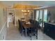Elegant dining room with a large table and chandelier at 9524 Bay Vista Estates Blvd, Orlando, FL 32836