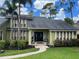 Two story home with green exterior and black door at 9524 Bay Vista Estates Blvd, Orlando, FL 32836