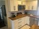 Renovated kitchen with granite countertops and stainless steel appliances at 9524 Bay Vista Estates Blvd, Orlando, FL 32836
