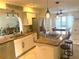 Renovated kitchen with granite countertops and stainless steel appliances at 9524 Bay Vista Estates Blvd, Orlando, FL 32836