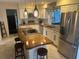 Renovated kitchen with granite countertops and stainless steel appliances at 9524 Bay Vista Estates Blvd, Orlando, FL 32836