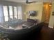 Relaxing living room with sectional sofa and large TV at 9524 Bay Vista Estates Blvd, Orlando, FL 32836