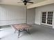 Screened patio with tiled floor and a ceiling fan at 9524 Bay Vista Estates Blvd, Orlando, FL 32836