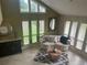 Sunroom with ample natural light and comfortable seating at 9524 Bay Vista Estates Blvd, Orlando, FL 32836