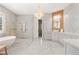 Luxurious bathroom with soaking tub, walk-in shower, and dual sinks at 222 Acadia Ter, Celebration, FL 34747