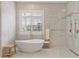 Spa-like bathroom with freestanding tub and walk-in shower at 222 Acadia Ter, Celebration, FL 34747