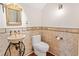 Small bathroom with a pedestal sink and beige tile at 222 Acadia Ter, Celebration, FL 34747