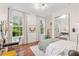 Bright bedroom with large windows, desk and built-in mirrored closet at 222 Acadia Ter, Celebration, FL 34747
