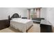 Bedroom with a queen-size bed, a couch and window at 222 Acadia Ter, Celebration, FL 34747