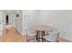 Small dining area with a round table and four white chairs at 222 Acadia Ter, Celebration, FL 34747
