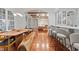 Open dining area with a long wooden table and modern bar seating at 222 Acadia Ter, Celebration, FL 34747
