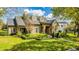 Two-story stone house with manicured lawn and landscaping at 222 Acadia Ter, Celebration, FL 34747
