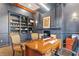 Elegant home office features built-in shelves, fireplace, and comfortable seating at 222 Acadia Ter, Celebration, FL 34747