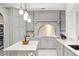 Bright kitchen with white quartz countertops and gray shaker cabinets at 222 Acadia Ter, Celebration, FL 34747