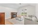 Living room with a fireplace, couch, and access to a balcony at 222 Acadia Ter, Celebration, FL 34747