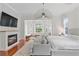 Spacious main bedroom with fireplace, sitting area, and large windows at 222 Acadia Ter, Celebration, FL 34747