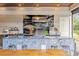 Luxury outdoor kitchen with a granite island and built-in grill at 222 Acadia Ter, Celebration, FL 34747