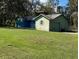 Single story home with a mature lawn and attached garage needs some TLC and is waiting for renovation at 1440 Walker Rd, Lakeland, FL 33810
