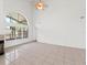 Living room with vaulted ceiling, fireplace and sliding glass doors at 302 Lakebreeze Cir, Lake Mary, FL 32746