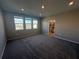 Spacious bedroom bathed in natural light, enhanced by plush carpeting and neutral walls at 1227 Teal Creek Dr, Saint Cloud, FL 34771