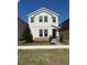 Charming two-story home features stone accents, neat landscaping, and an inviting covered entrance at 1227 Teal Creek Dr, Saint Cloud, FL 34771