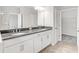 Elegant Primary bathroom featuring dual sinks with granite countertops and a walk-in closet at 1231 Teal Creek Dr, St Cloud, FL 34771