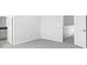 An empty bedroom featuring an ensuite bathroom and a closet across the room at 1231 Teal Creek Dr, St Cloud, FL 34771
