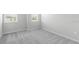 Empty bedroom with carpet floors and two windows providing natural light at 1231 Teal Creek Dr, St Cloud, FL 34771