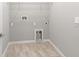 Empty laundry room with tile flooring and utility connections, ready for appliances at 1231 Teal Creek Dr, St Cloud, FL 34771