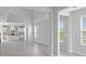 Bright, open-plan living room with tile flooring and neutral color palette at 1231 Teal Creek Dr, St Cloud, FL 34771