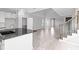 Open-concept living space featuring high ceilings, tile flooring, and natural light from multiple windows at 1231 Teal Creek Dr, St Cloud, FL 34771