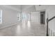 Spacious living room boasting high ceilings, tile floors, and abundant natural light through large windows at 1231 Teal Creek Dr, St Cloud, FL 34771
