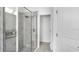 Modern bathroom featuring a glass-enclosed shower with gray tile and sleek fixtures at 5267 Stone Ridge Pl, St Cloud, FL 34771