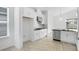 Well-lit kitchen featuring stainless steel appliances and white cabinets at 5267 Stone Ridge Pl, St Cloud, FL 34771