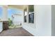View of the home's covered porch and brick paved floor at 5267 Stone Ridge Pl, St Cloud, FL 34771