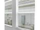 Windows with partially closed blinds offering a glimpse of the neighborhood at 5267 Stone Ridge Pl, St Cloud, FL 34771