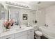 Bright bathroom features a shower-tub combo, vanity with modern fixtures, and stylish accents at 5536 Metrowest Blvd # 8-304, Orlando, FL 32811