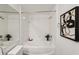 Clean bathroom features a tub-shower combo, white tile, and modern fixtures at 5536 Metrowest Blvd # 8-304, Orlando, FL 32811