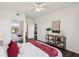 Comfortable bedroom featuring a mirrored closet, ceiling fan and stylish furnishings at 5536 Metrowest Blvd # 8-304, Orlando, FL 32811