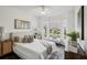Inviting bedroom with natural light, comfortable furnishings, and serene views at 5536 Metrowest Blvd # 8-304, Orlando, FL 32811