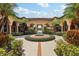 Community courtyard showcasing lush landscaping, water features, and inviting architecture at 5536 Metrowest Blvd # 8-304, Orlando, FL 32811