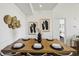 Dining area with stylish decor, set for a meal, and adjacent to the kitchen at 5536 Metrowest Blvd # 8-304, Orlando, FL 32811