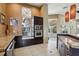 Modern kitchen featuring stainless steel appliances, granite countertops, and dark cabinets at 5536 Metrowest Blvd # 8-304, Orlando, FL 32811