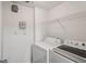 Functional laundry room equipped with a washer and dryer for added convenience at 5536 Metrowest Blvd # 8-304, Orlando, FL 32811