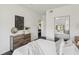 Bright bedroom with white walls, dark floors and mirrored closet reflects a cozy, inviting space at 5536 Metrowest Blvd # 8-304, Orlando, FL 32811