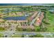 Aerial view showing home location within a community near a lake at 10747 Belfry Cir, Orlando, FL 32832