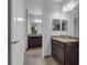 Modern bathroom with double vanity and granite countertop at 10747 Belfry Cir, Orlando, FL 32832