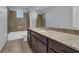 Clean bathroom, featuring a shower/tub combo and granite vanity at 10747 Belfry Cir, Orlando, FL 32832