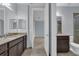 Bathroom with double vanity and access to bedroom and hallway at 10747 Belfry Cir, Orlando, FL 32832