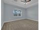 Bright bedroom with carpeted floor and large window at 10747 Belfry Cir, Orlando, FL 32832